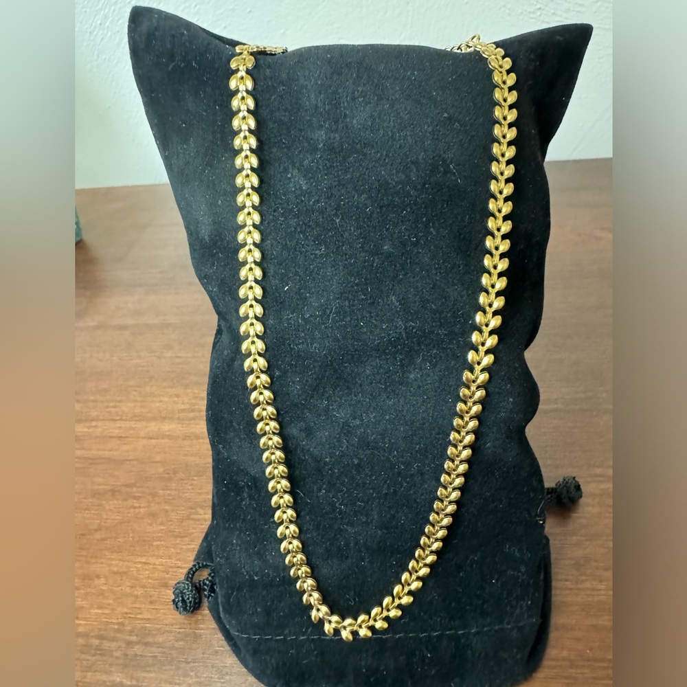 Gold toned stainless steel puffy leaf necklace